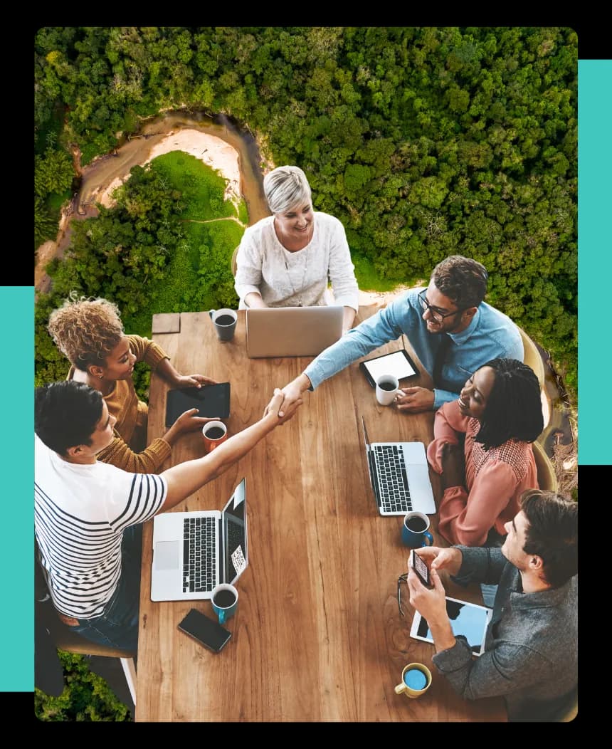 An aerial view of people gathered around a table in engagement