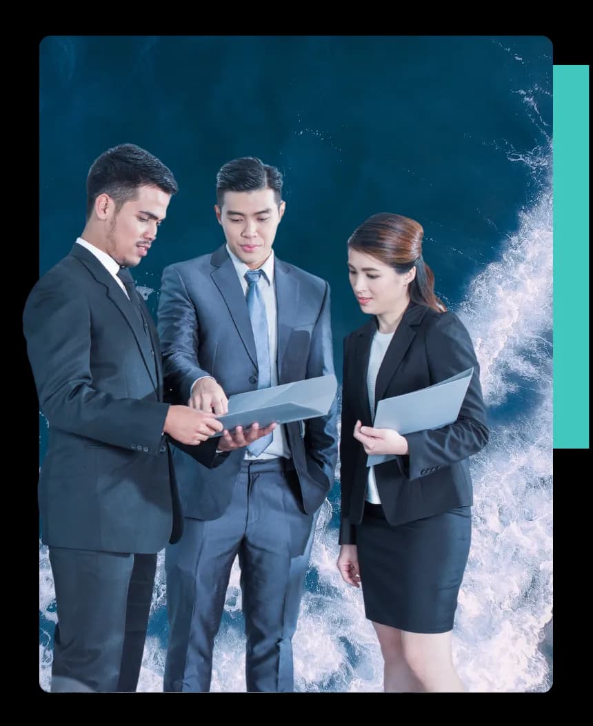 Three people standing while pointing out gaps and areas of improvement